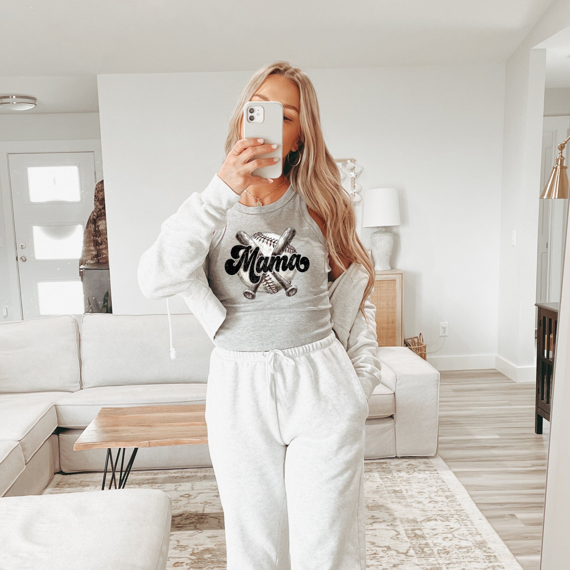 a woman taking a selfie in a living room