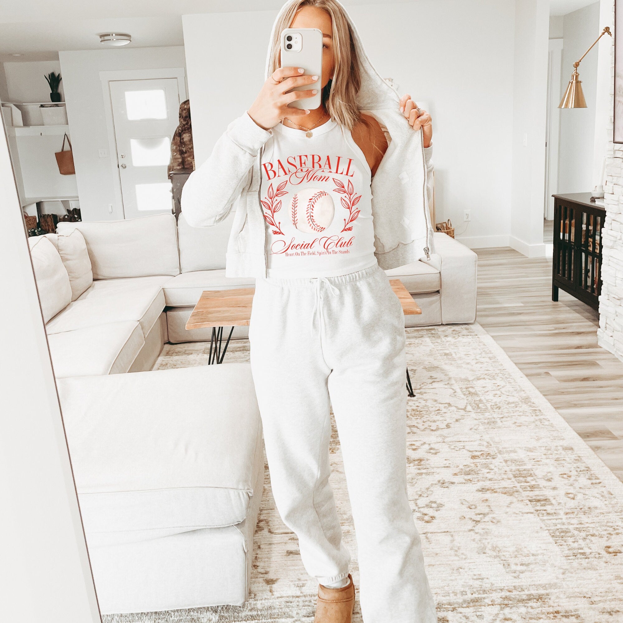 a woman taking a selfie in a living room