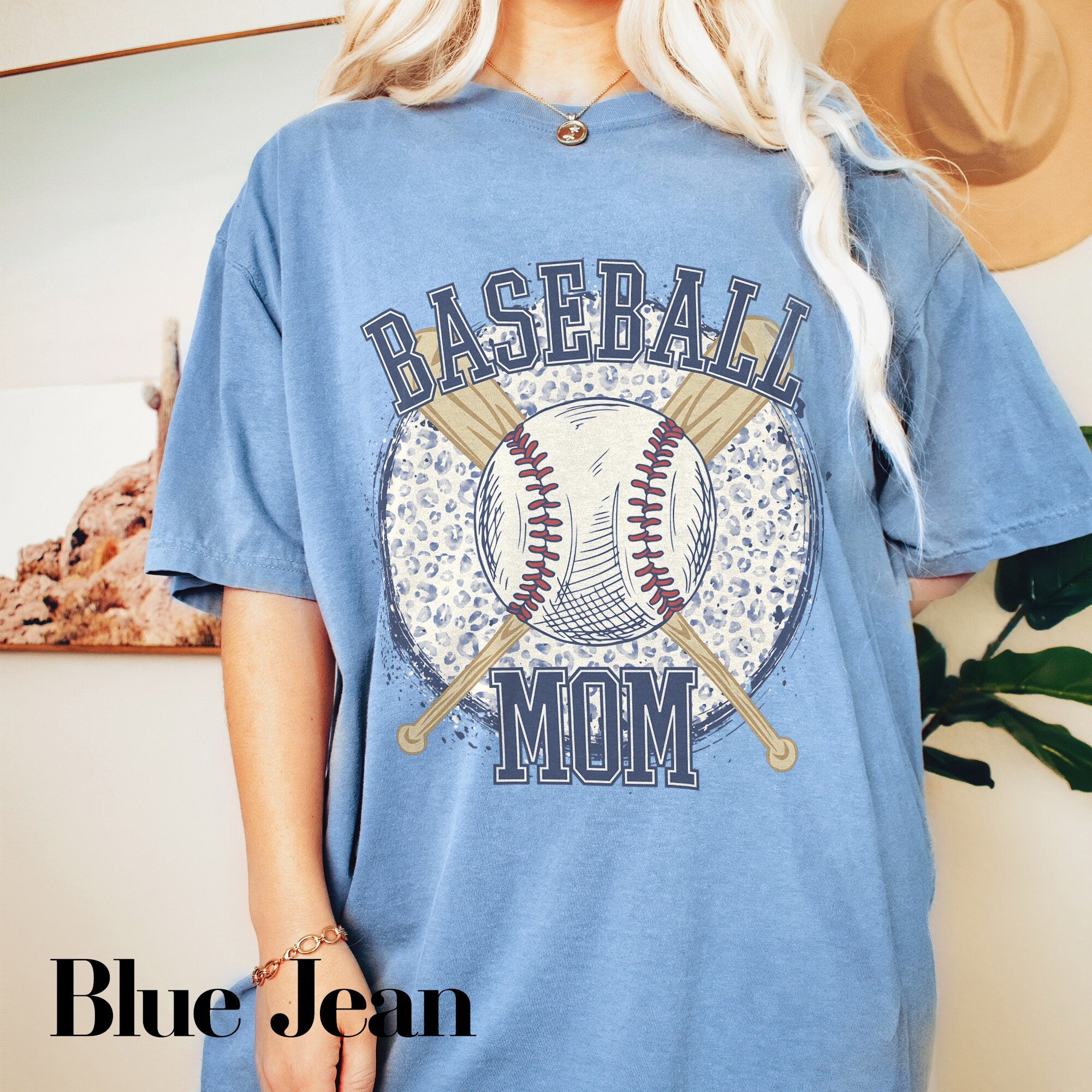 a blonde woman wearing a baseball mom shirt