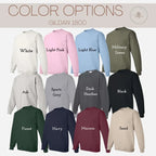 a collection of 12 different colored GILAN 1800 sweatshirts, each with a unique color and design.