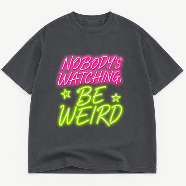 Nobody's Watching Be Weird graphic tee for women in Black, oversized garment-dyed shirt by The Southern Thistle