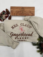 Mrs. Claus’ Gingerbread Bakery Embroidered Sweatshirt – Festive Christmas Crewneck