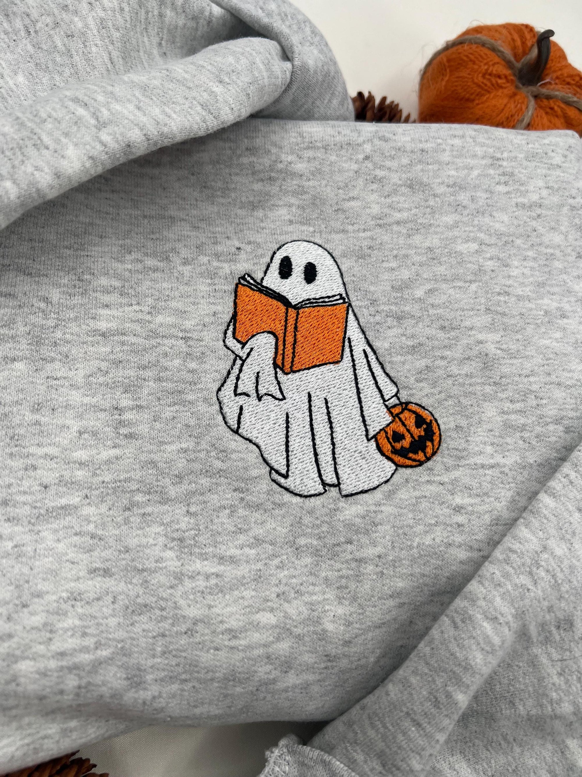 Bookworm Ghost Embroidered Sweatshirt – Cute Halloween Pullover with Pumpkin
