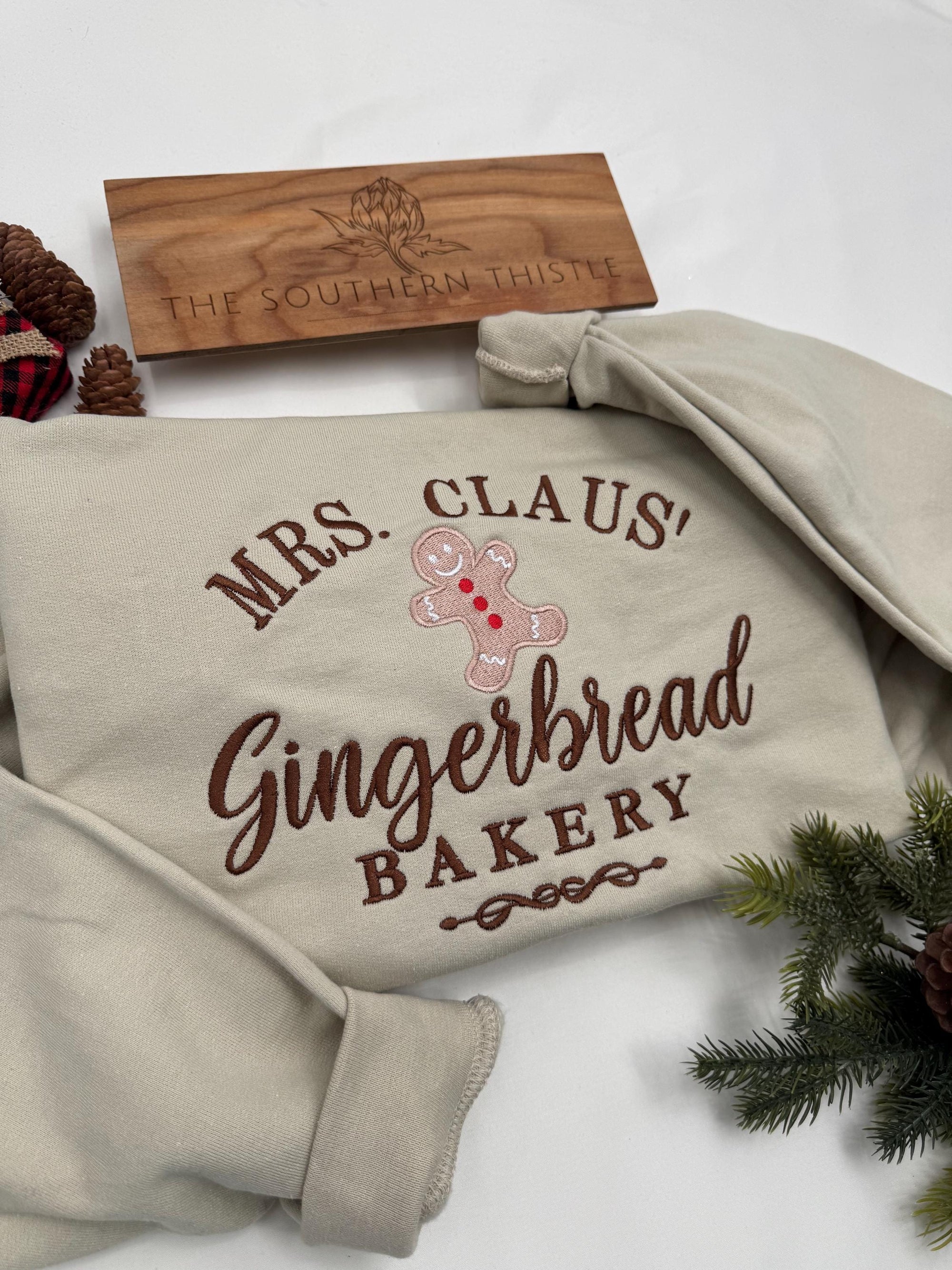Mrs. Claus’ Gingerbread Bakery Embroidered Sweatshirt – Festive Christmas Crewneck