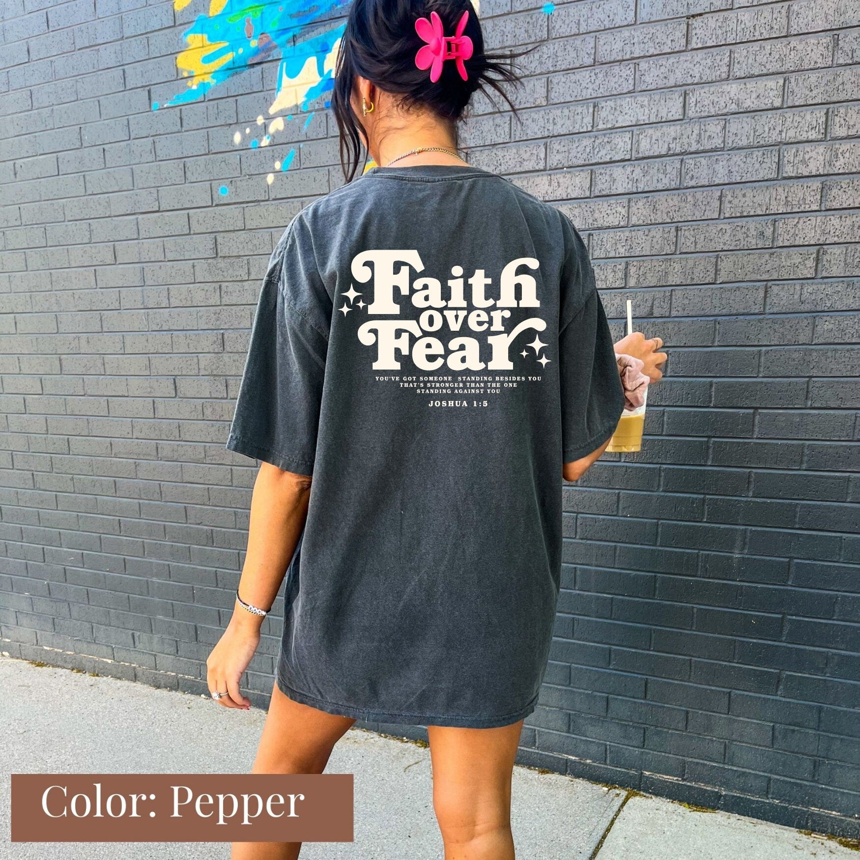 a woman is walking down the street with a drink in her hand