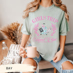 a woman sitting on a chair holding a cup of coffee
