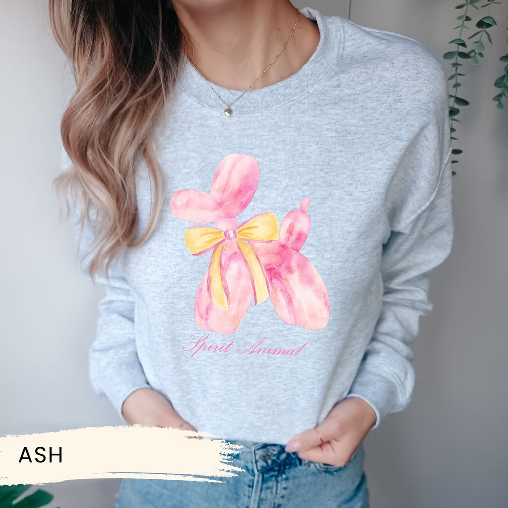 a woman wearing a sweatshirt with a flower on it