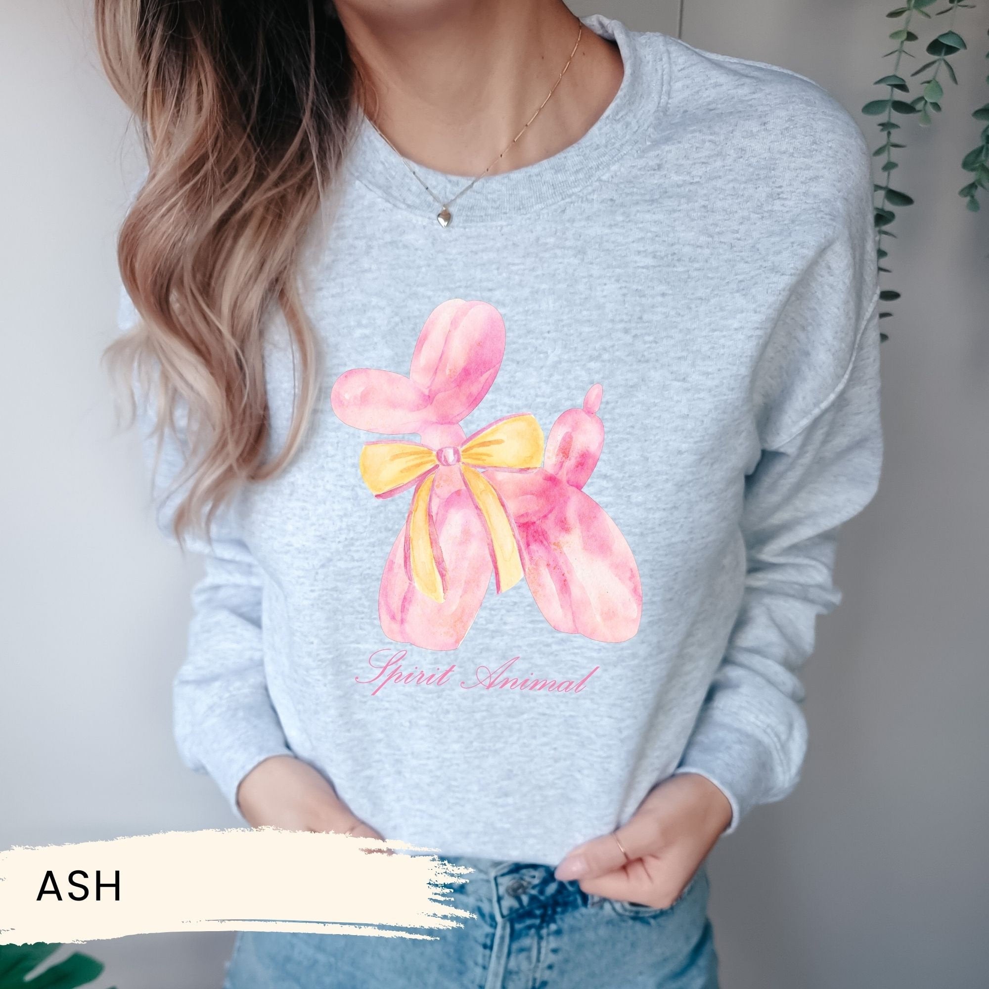 a woman wearing a sweatshirt with a flower on it