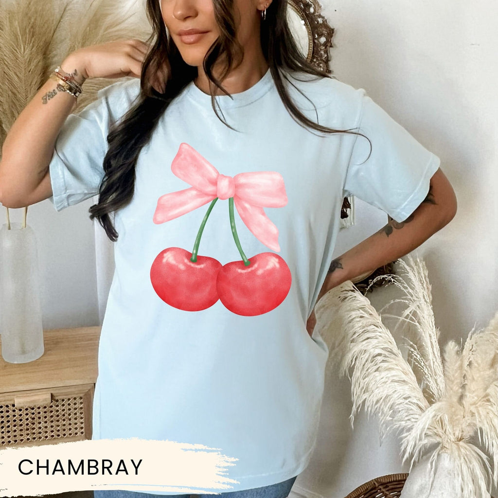 a woman wearing a t - shirt with cherries on it