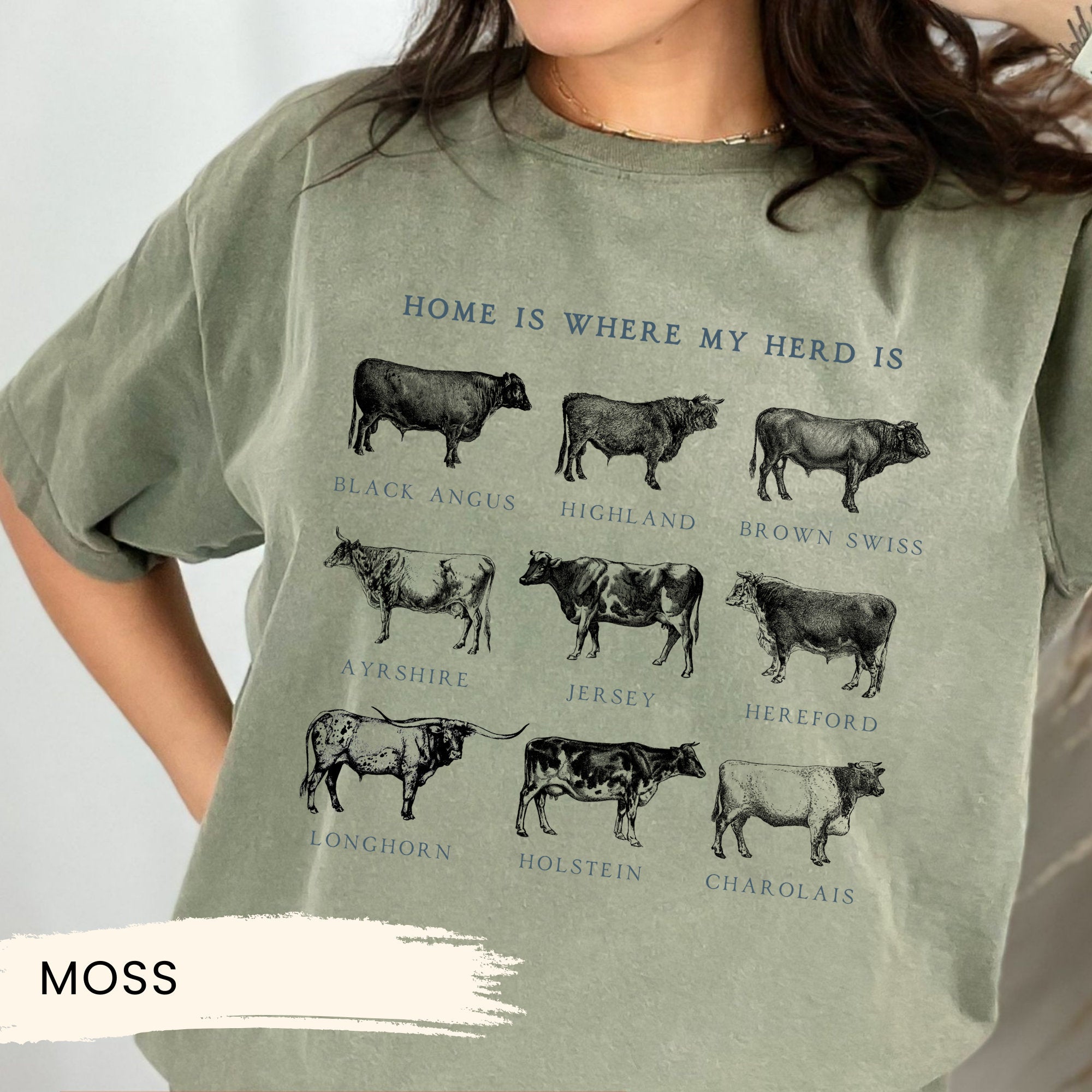 a woman wearing a t - shirt with cows on it