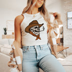 a woman sitting on a couch wearing a cowboy hat and smoking a cigarette
