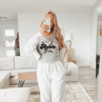 a woman taking a selfie in a living room