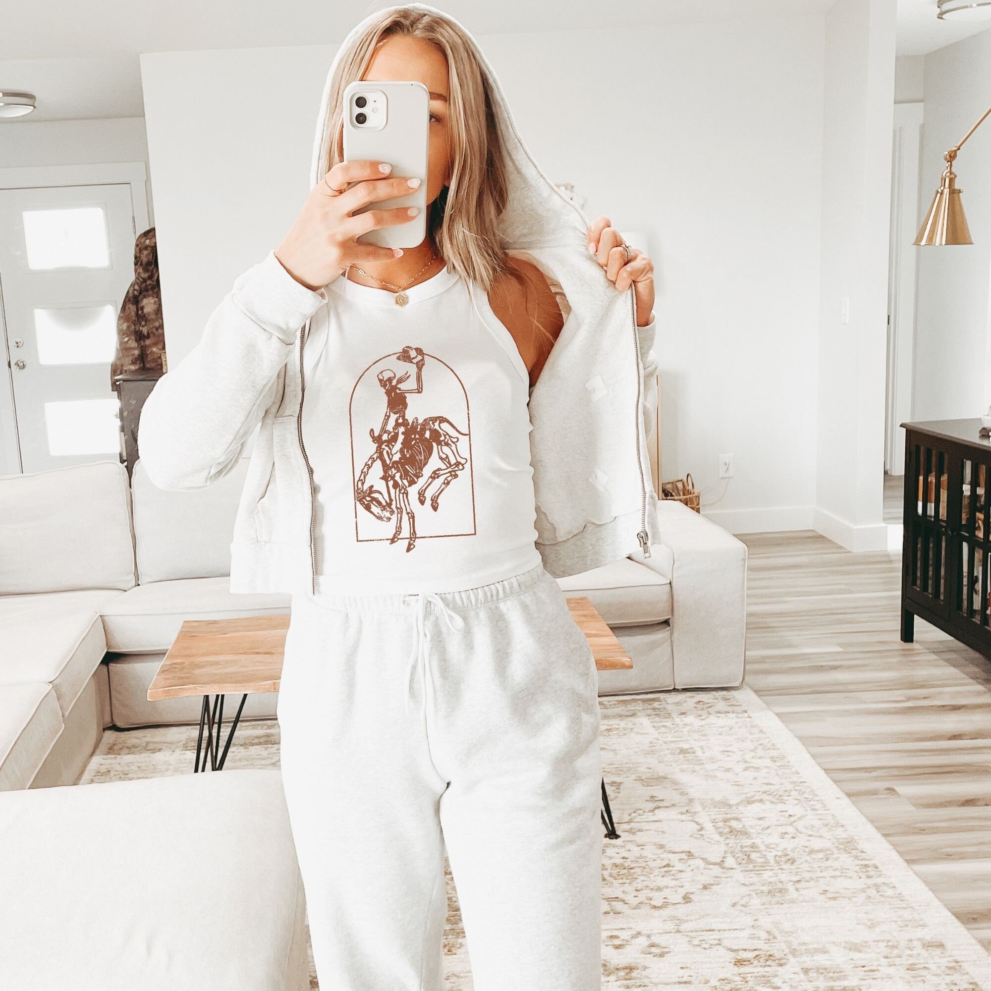 a woman taking a selfie in her pajamas