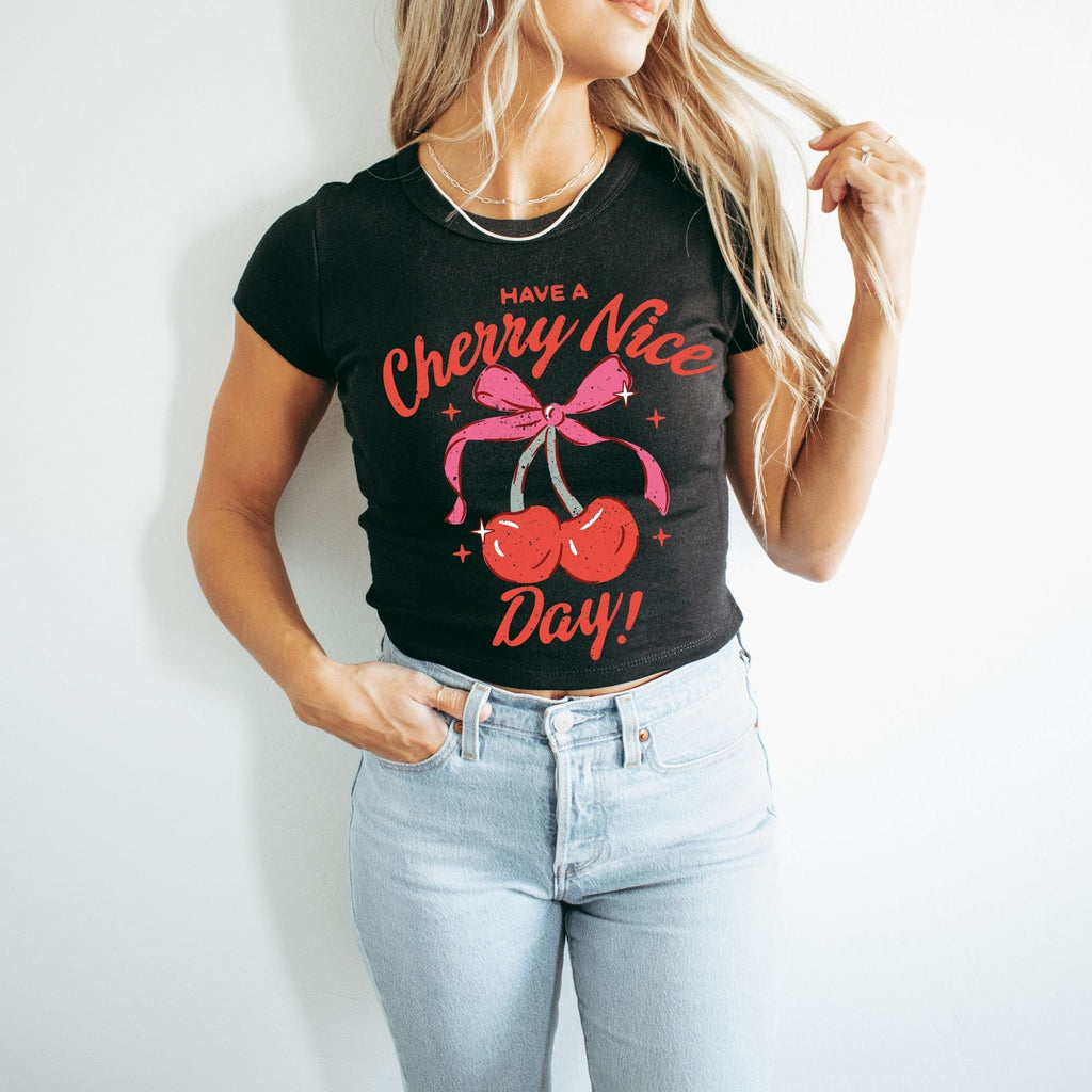 a woman wearing a black cherry nice day t - shirt