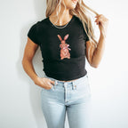 a woman wearing a black shirt with a rabbit on it
