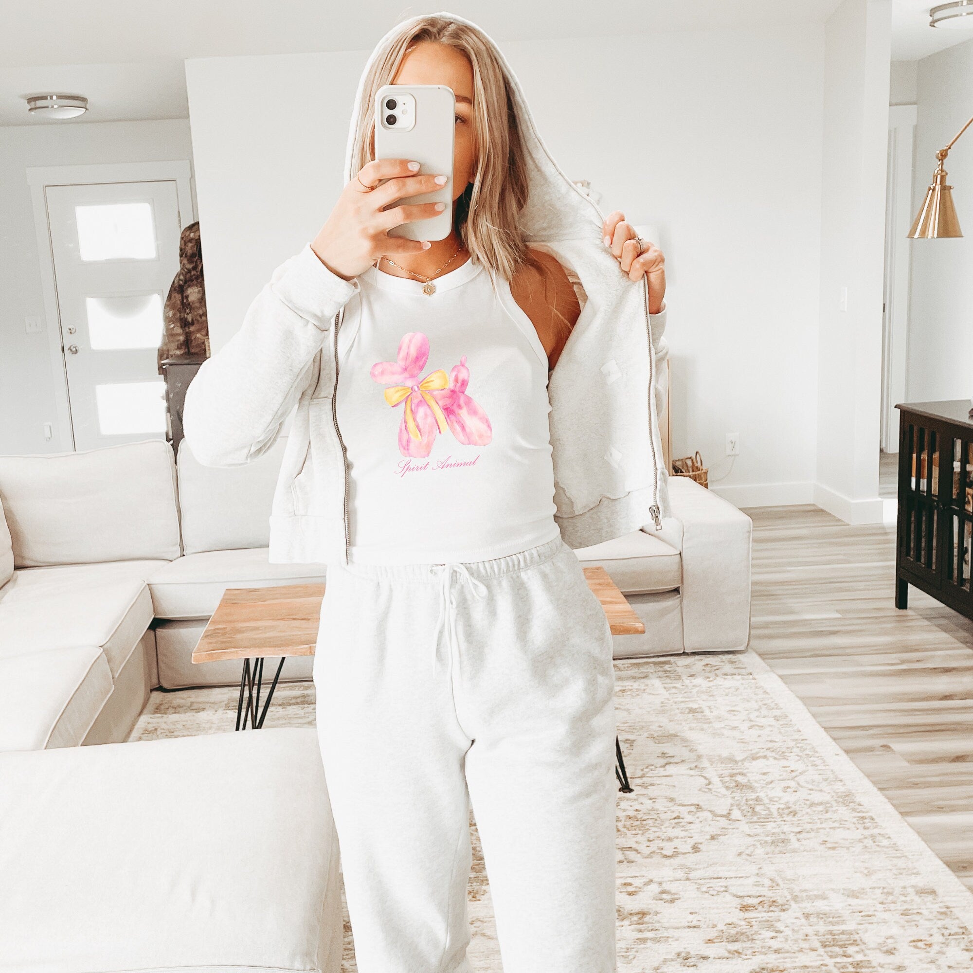 a woman taking a picture of herself in her pajamas