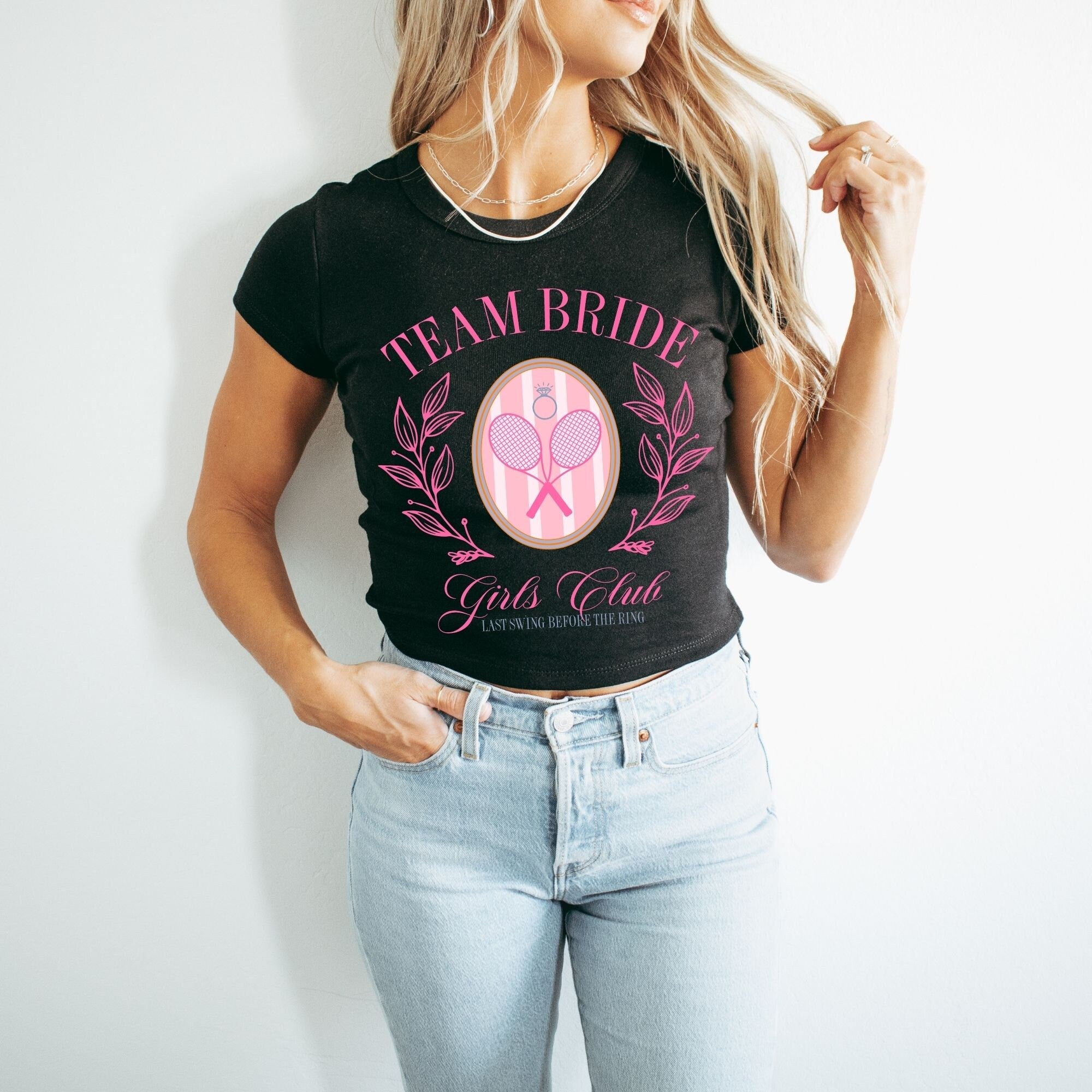 a woman wearing a t - shirt that says team bride