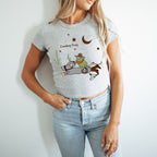 a woman wearing a t - shirt with a cartoon character on it