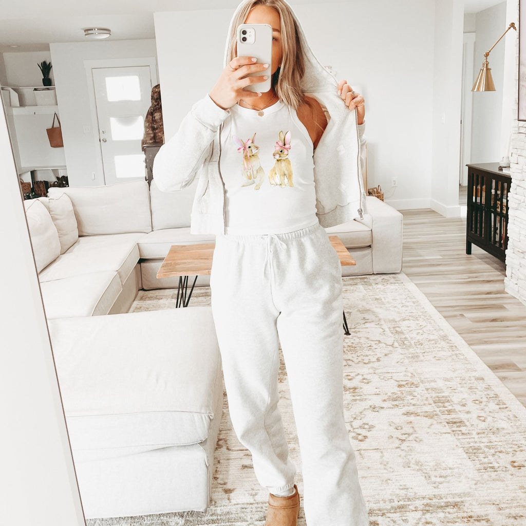 a woman taking a selfie in a living room