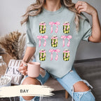 a woman sitting on a chair holding a cup of coffee