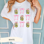 a woman wearing a white t - shirt with a jar of pickles on it