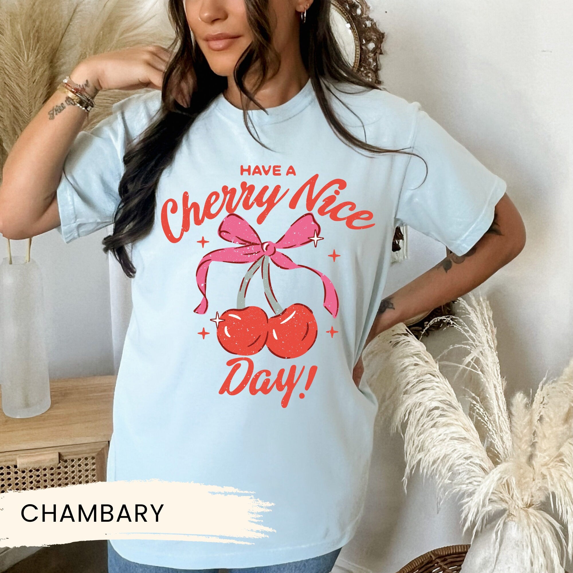 a woman wearing a cherry nice day t - shirt