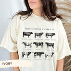 a woman wearing a t - shirt with cows on it