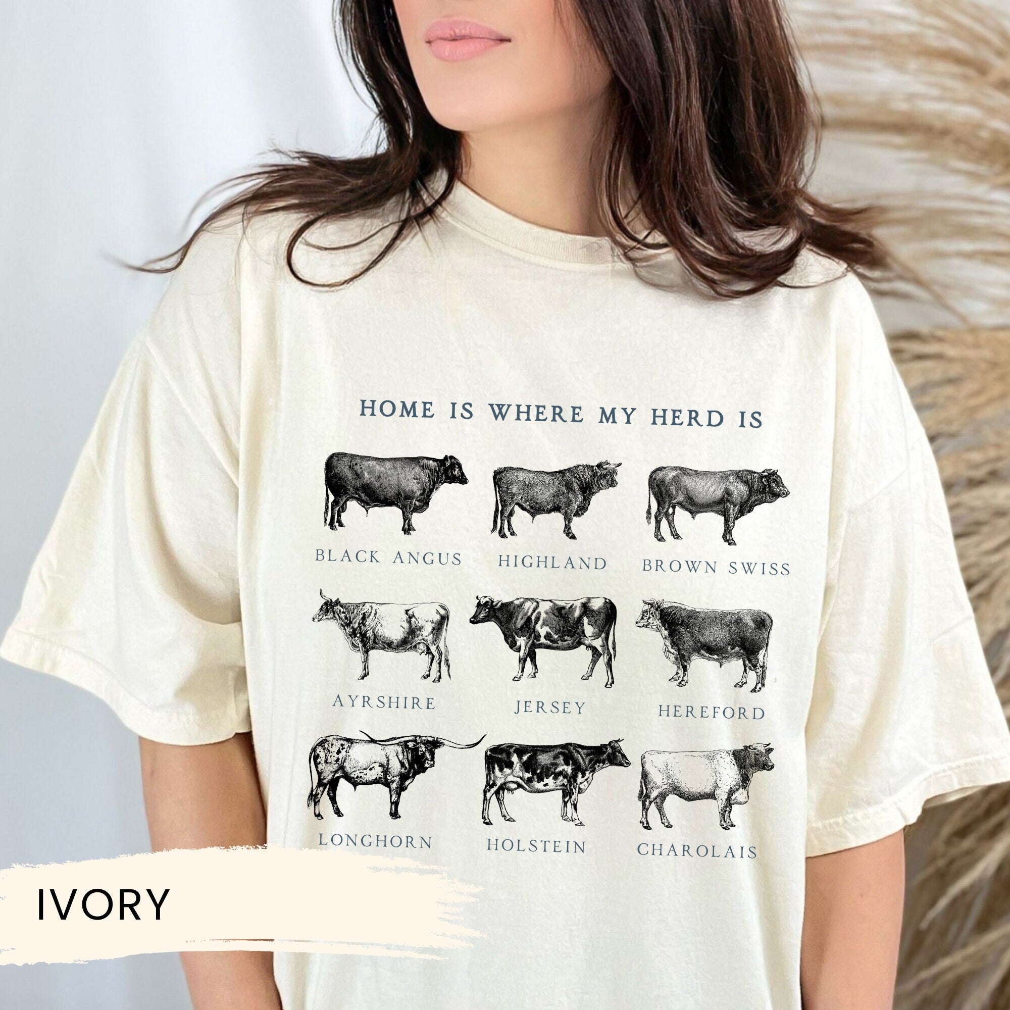 a woman wearing a t - shirt with cows on it