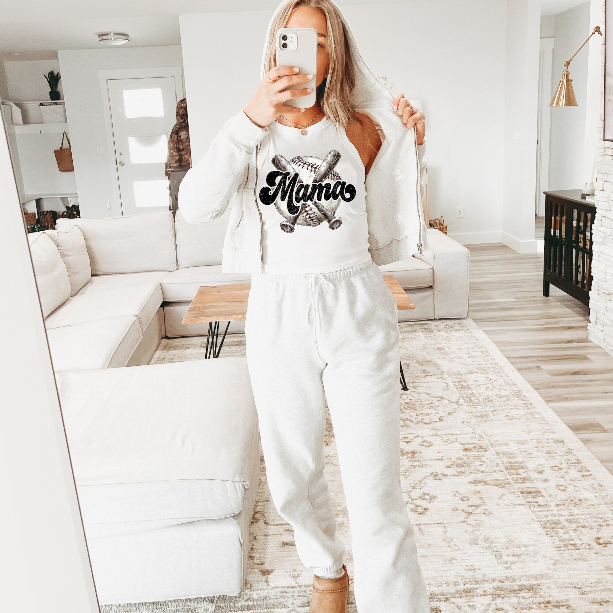 a woman taking a selfie in a living room