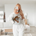 a woman taking a selfie in a living room