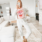 a woman taking a selfie in a living room
