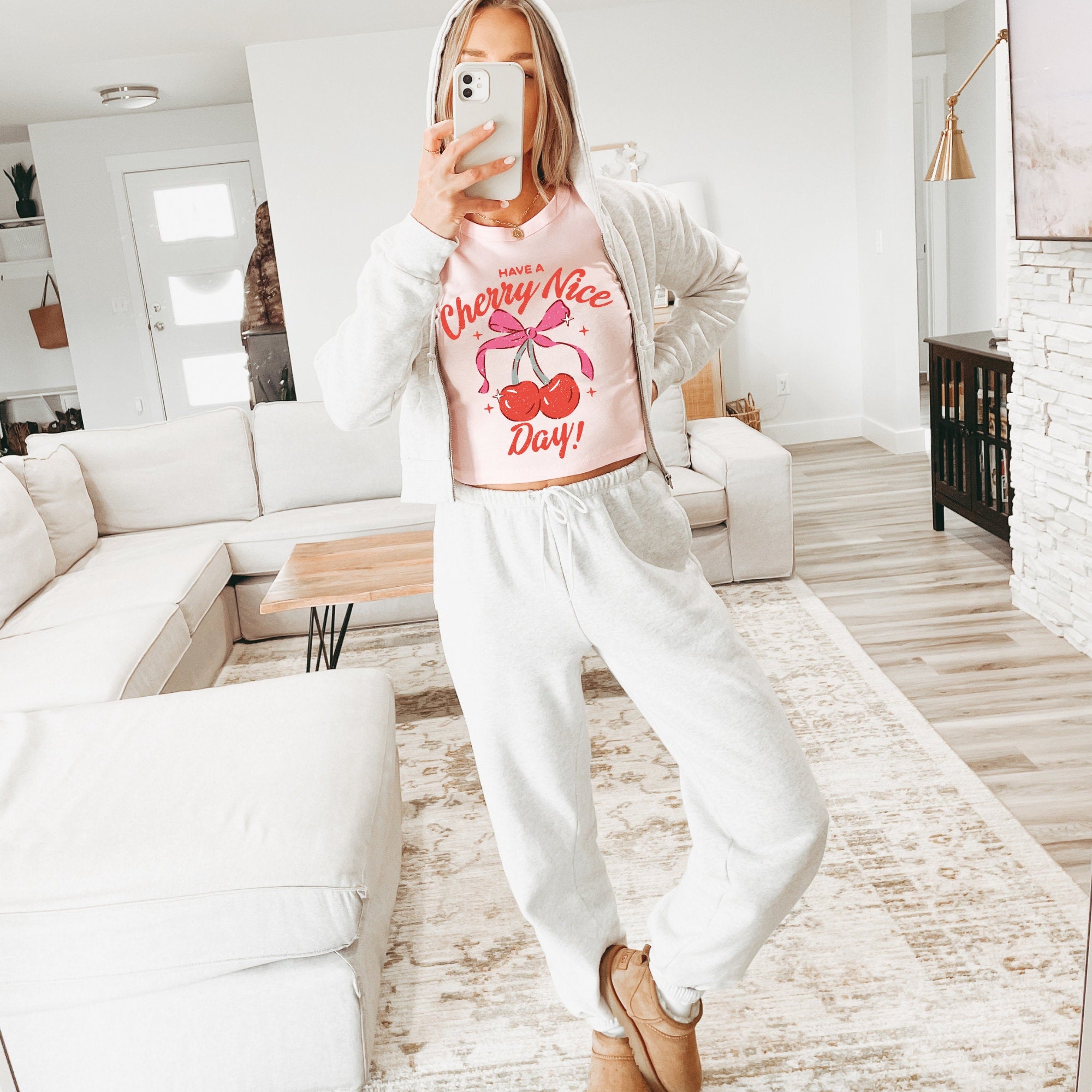 a woman taking a selfie in a living room