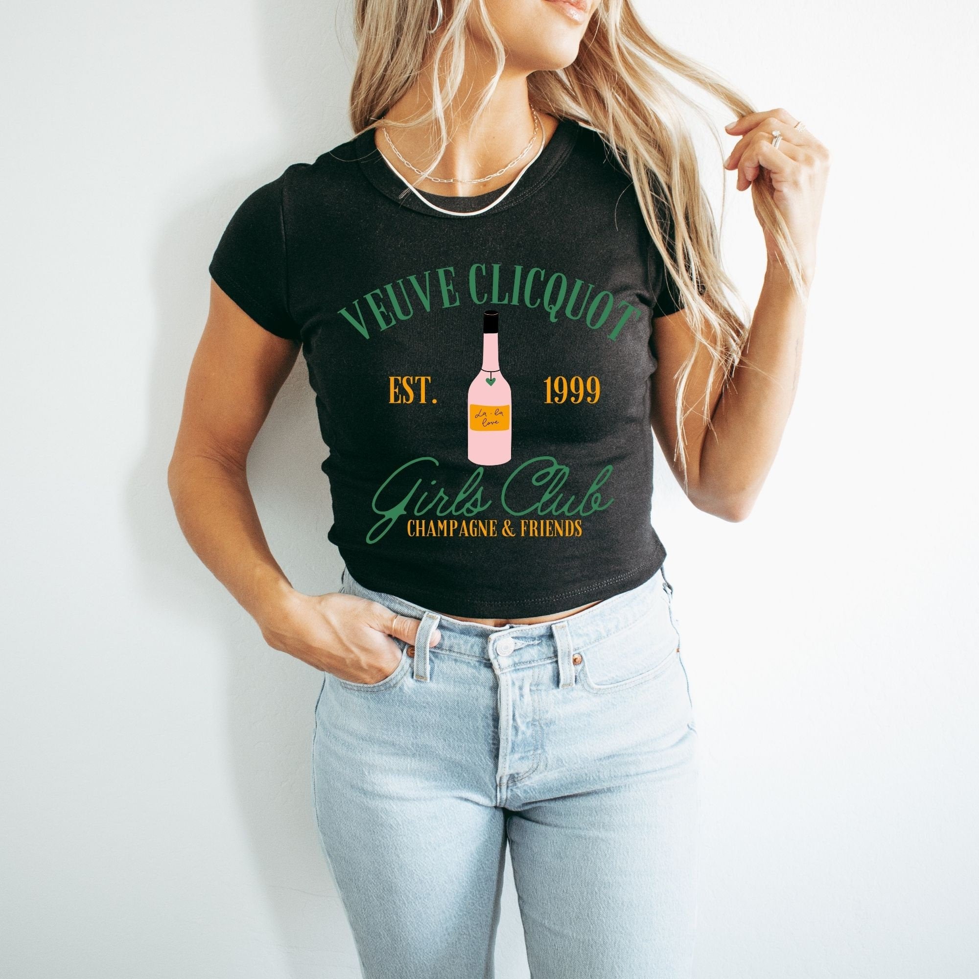 a woman wearing a black shirt with a bottle of wine on it