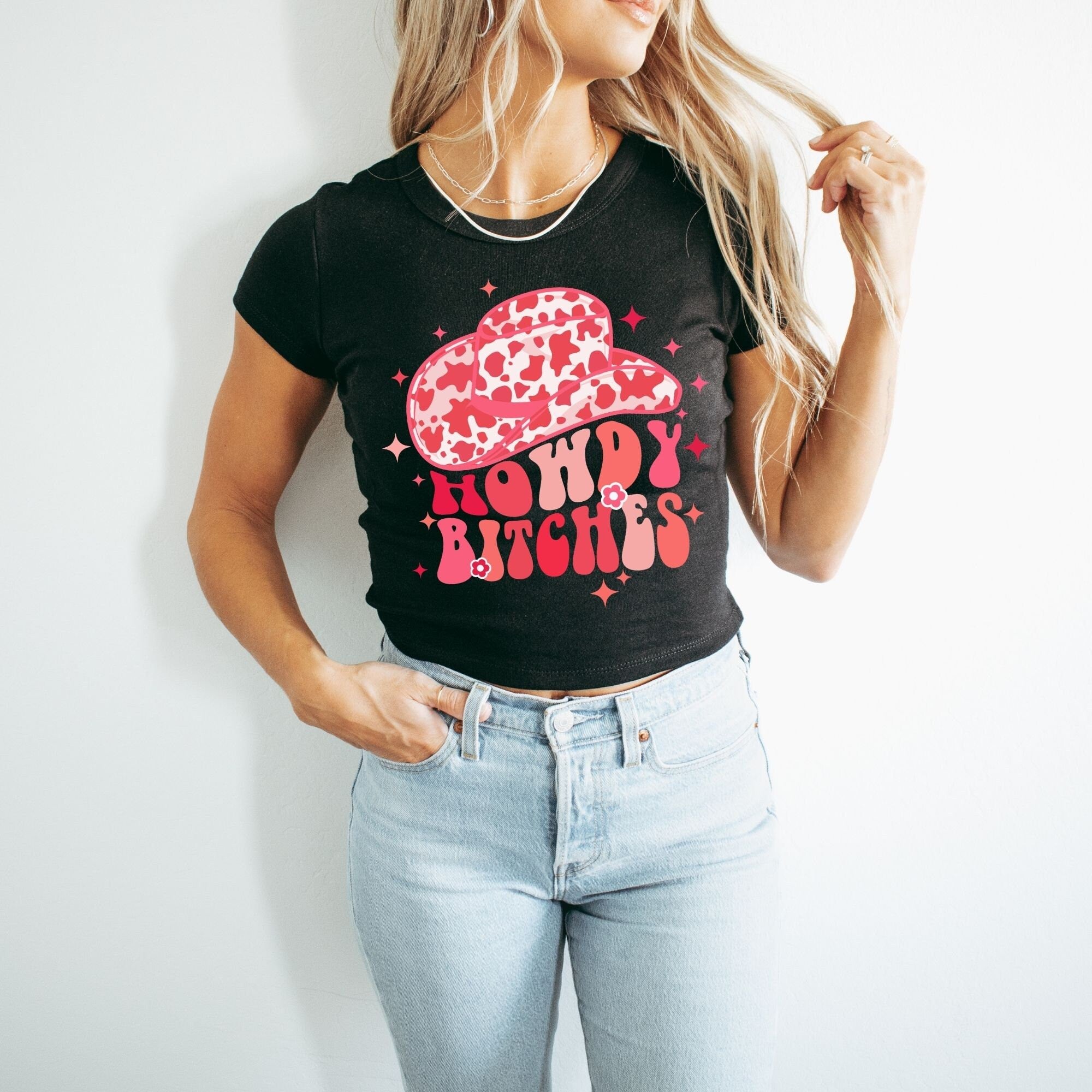 a woman wearing a happy bitch t - shirt