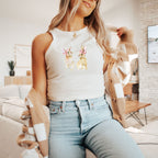 a woman sitting on a couch wearing a sweater and jeans