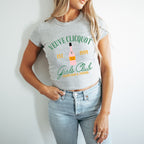 a woman wearing a tee shirt with a bottle of liquor on it
