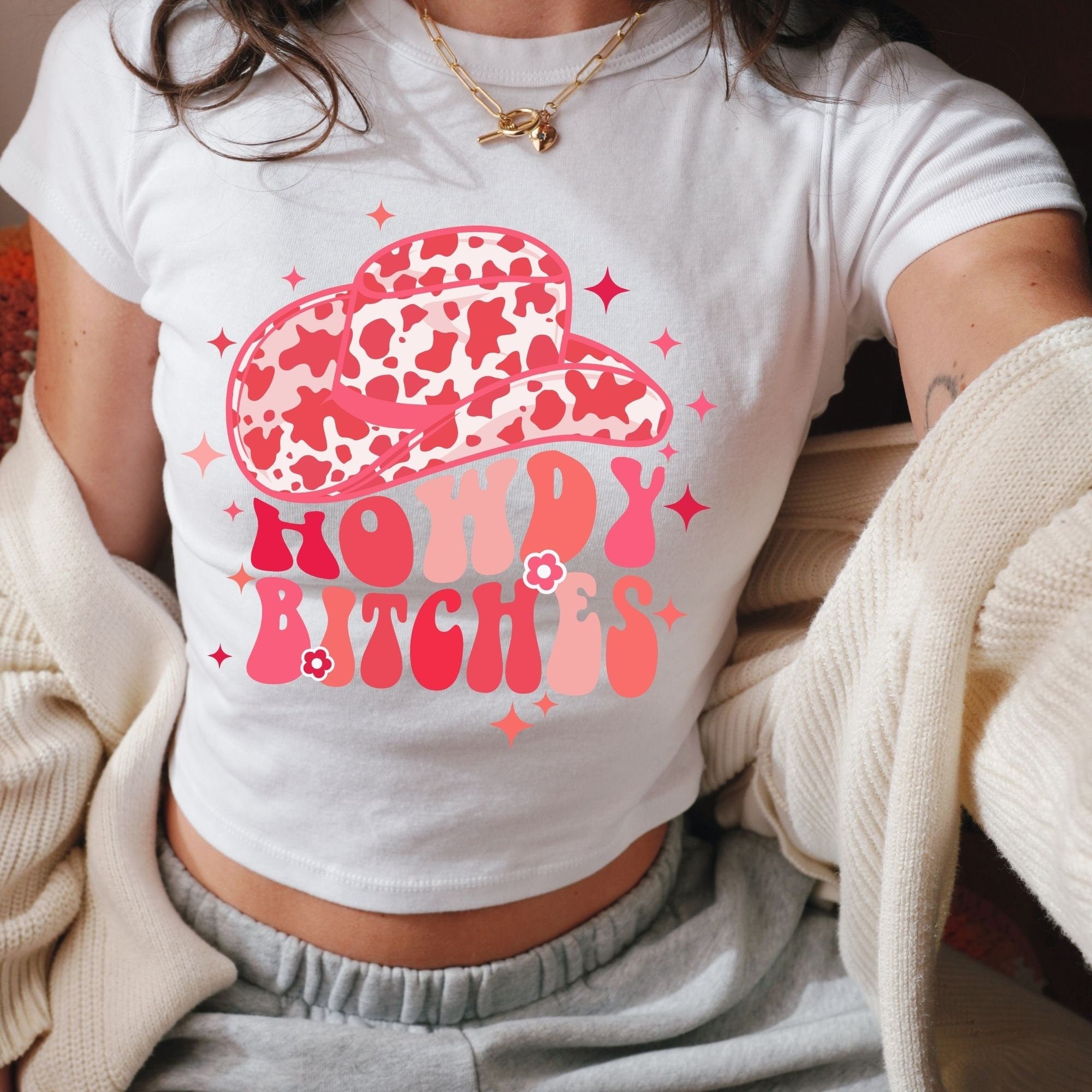 a woman wearing a white shirt with a leopard print on it