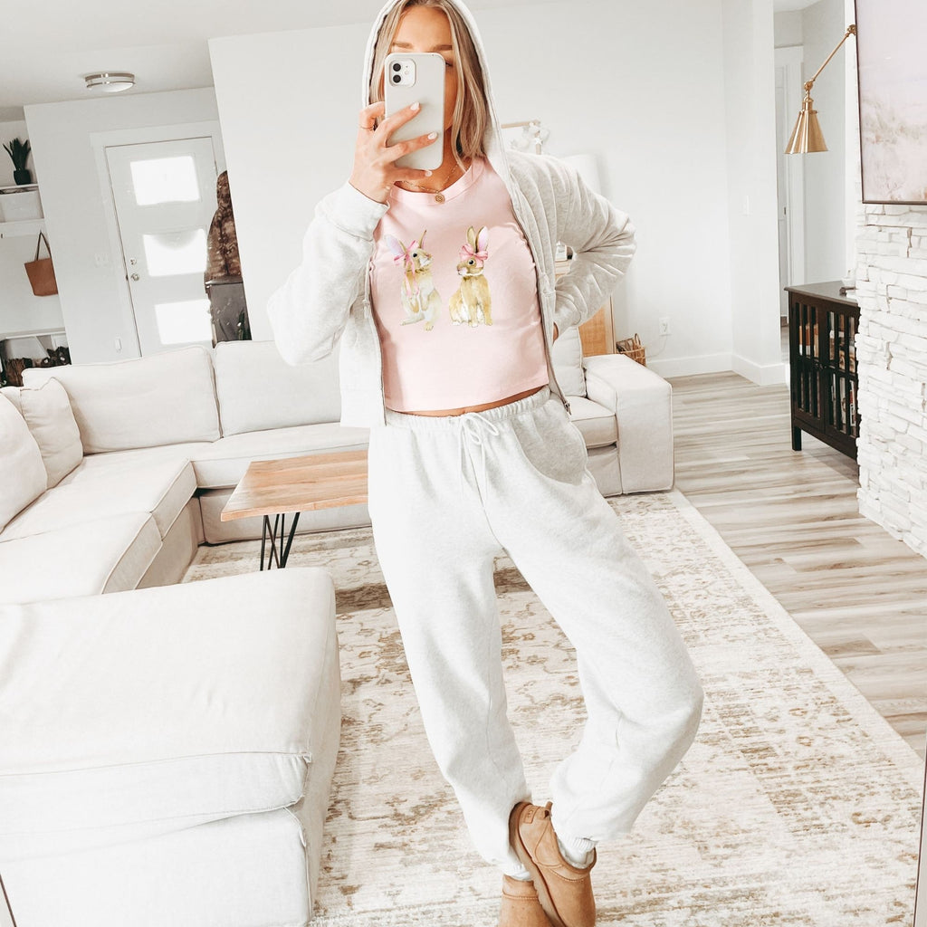 a woman taking a selfie in a living room