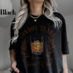 a woman wearing a cowboy tears t - shirt