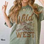 a woman with long hair wearing a wild west t - shirt