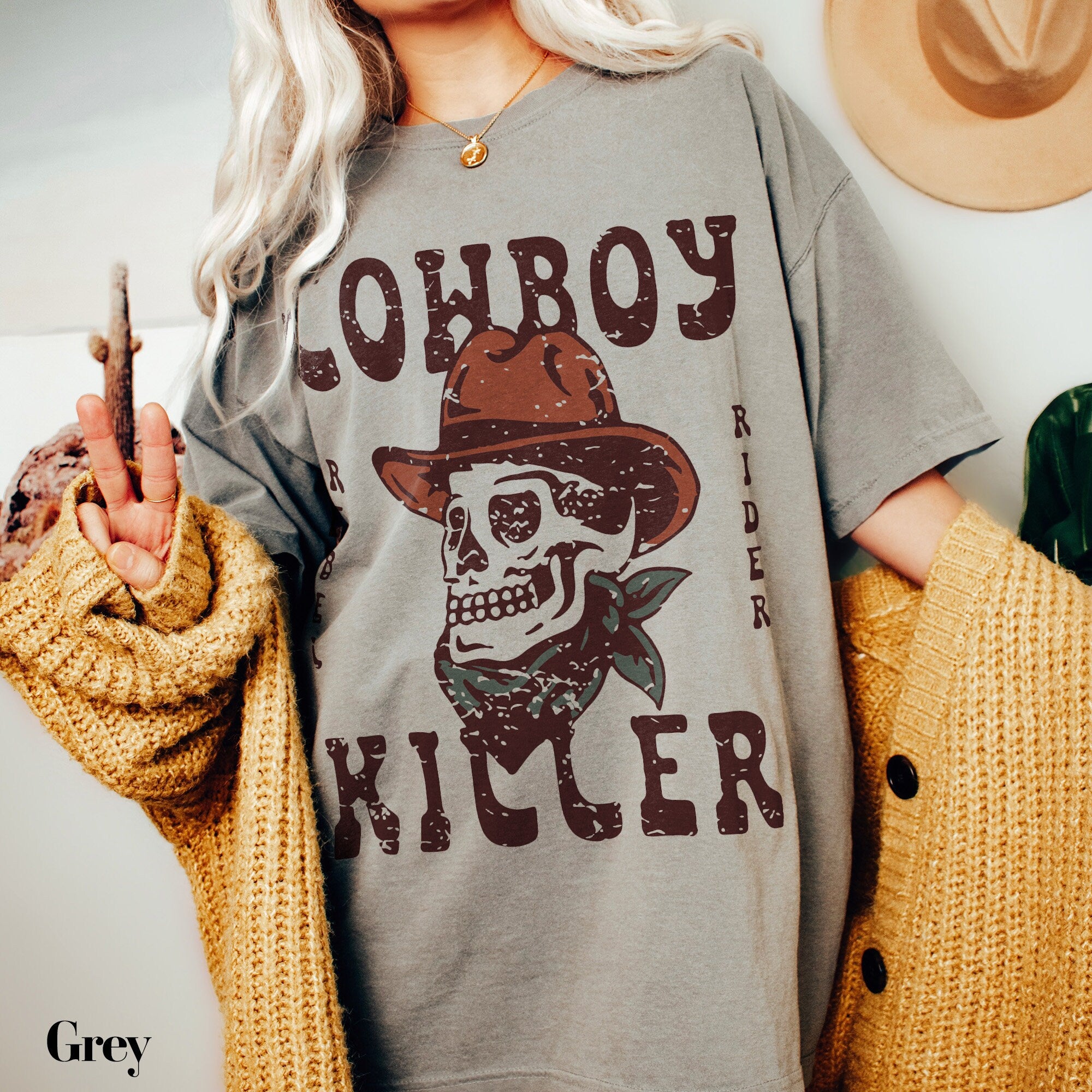 a woman wearing a cowboy shirt holding a cigar