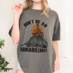 a woman wearing a shirt that says don&#39;t be an armadilloise