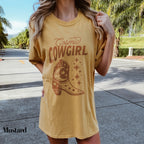 a woman wearing a cowboy hat and a t - shirt