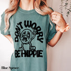 a woman wearing a t - shirt that says don&#39;t work be hippie