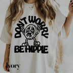 a woman wearing a t - shirt that says don&#39;t work be hippie