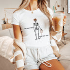 a woman sitting on a couch holding a drink