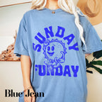 a woman wearing a blue shirt with a cartoon character on it