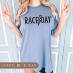 a woman wearing a blue raceday t - shirt