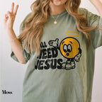 a woman wearing a green shirt with a smiley face on it