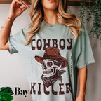 a woman wearing a cowboy skull t - shirt